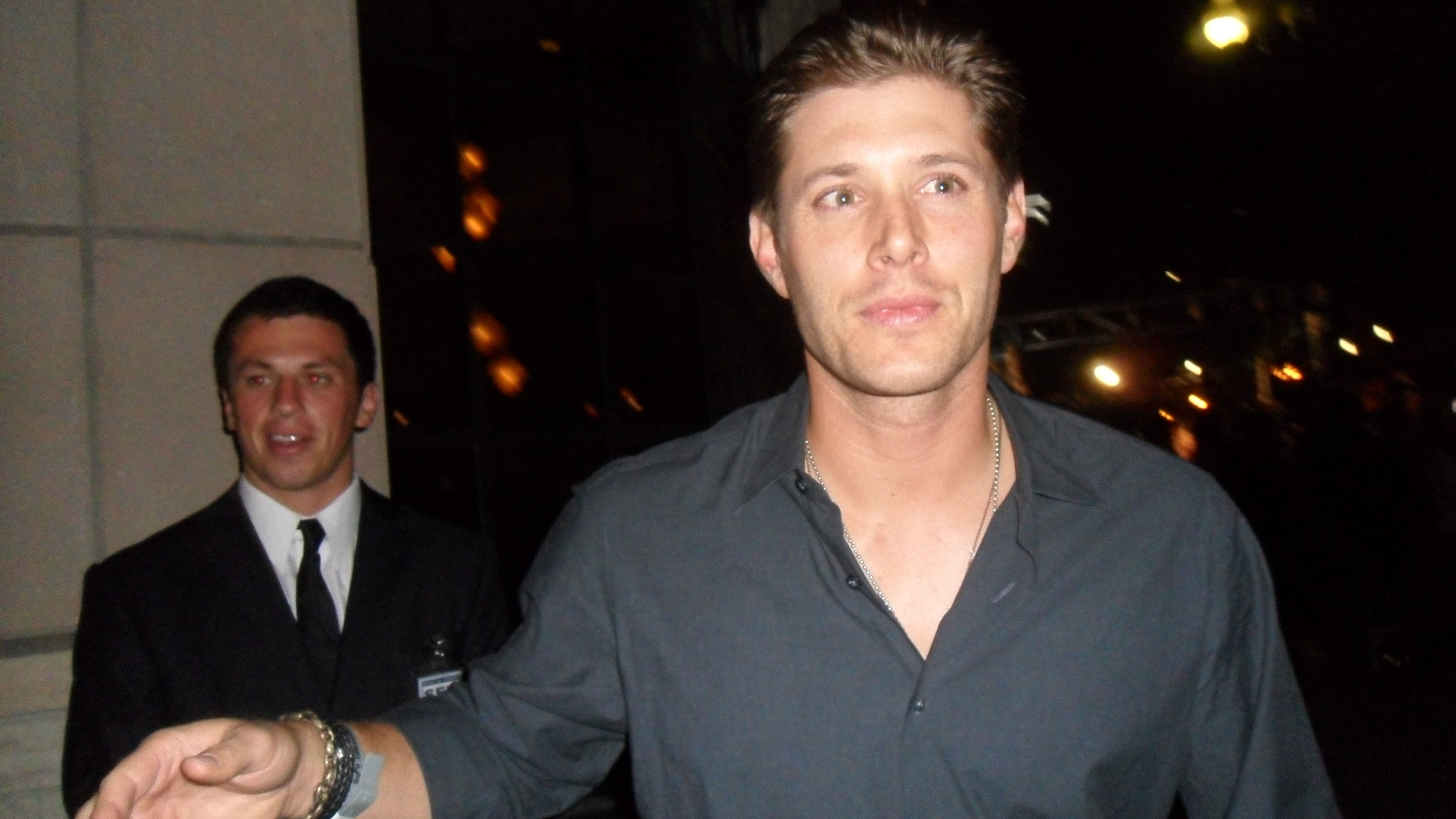 Jensen Ackles photographed at a fan event, landscape portrait