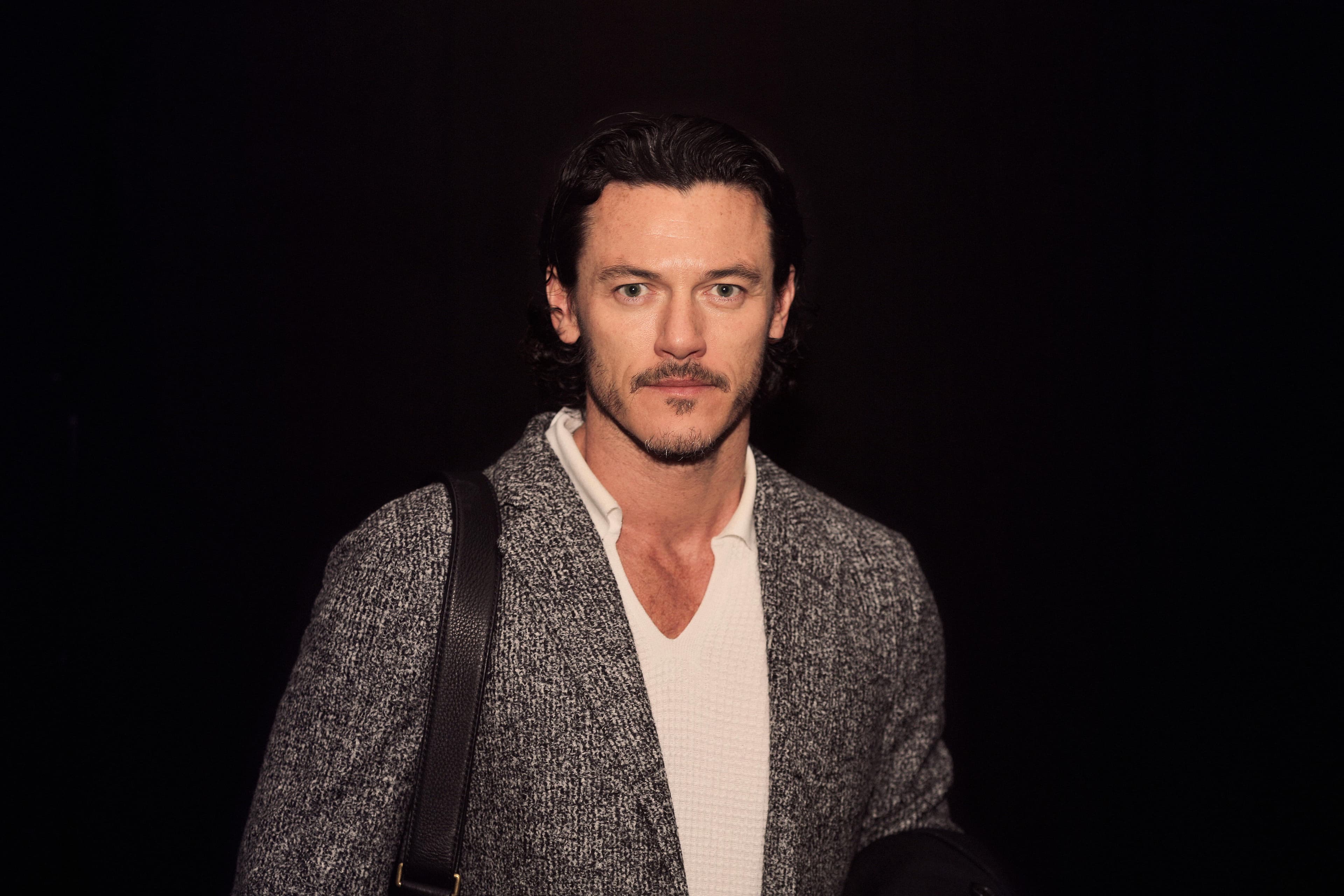 Luke Evans photographed at a public event in London
