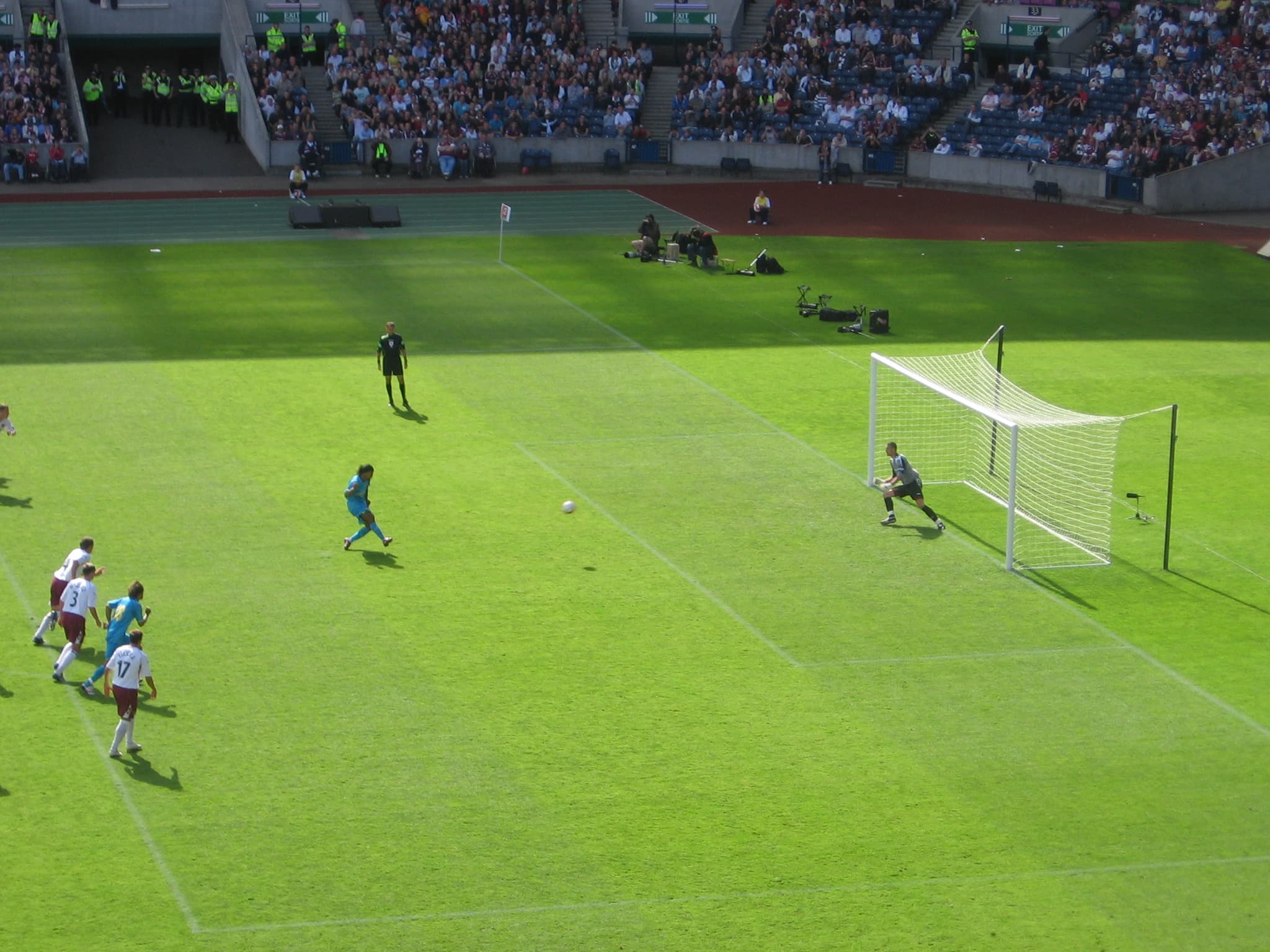Ronaldinho in Barcelona kit celebrating with hands to his heart